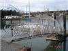 Metal foot bridge with fish images titled 