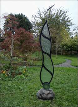 Vertical etched glass sculpture titled 