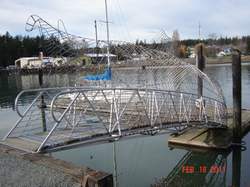 Metal foot bridge with fish images titled 